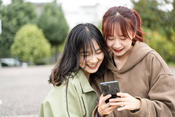 istock Two girls are taking photos 1431977540