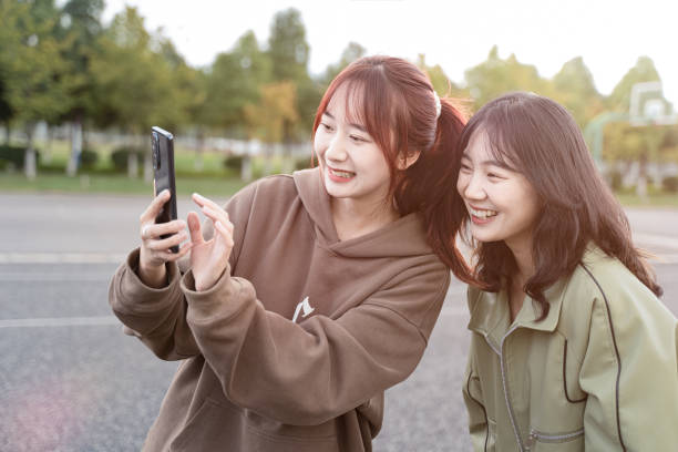 istock Two girls are taking photos 1431977555