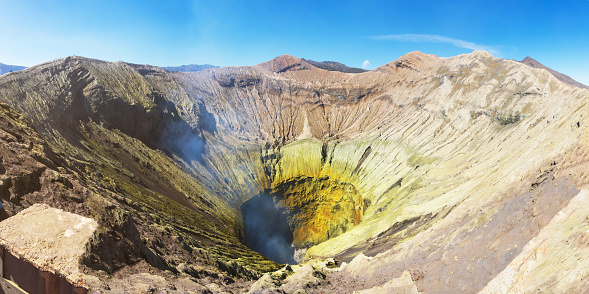The crater or summit of Mount Bromo is an active volcano and part of the Tengger massif, in East Java, Indonesia. Beautiful landscape and popular destinations in Indonesia. Panorama view