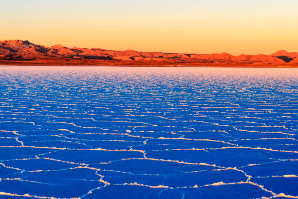 Salar de Uyuni (or Salar de Tunupa) is the world's largest salt flat at 10,582 square kilometers (4,086 sq mi). It is located  in the Potosi and Oruro departments in southwest Bolivia, near the crest of the Andes, and is elevated 3,656 meters above the mean sea level.