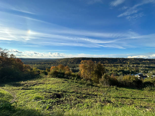 istock Beautiful autumn landscape with colorful trees and vast forests under a blue sky. 1431982202