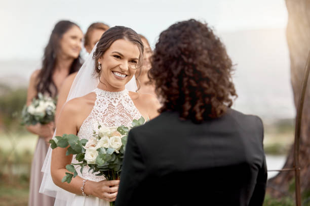 istock Wedding, couple and celebration at marriage nature event of love, support and commitment in outdoor garden park. Young married man and woman smile, happiness and joy celebrate happy future together 1431986465