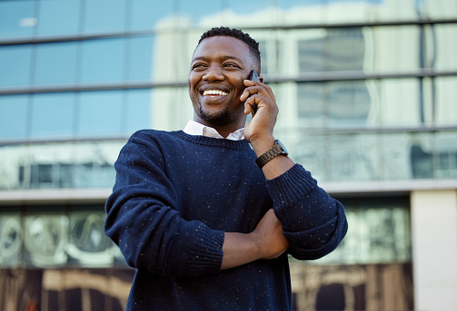 Phone, communication and networking with a business man talking on a call outside in the city in the day. Vision, motivation and conversation for growth, development and the future of his company