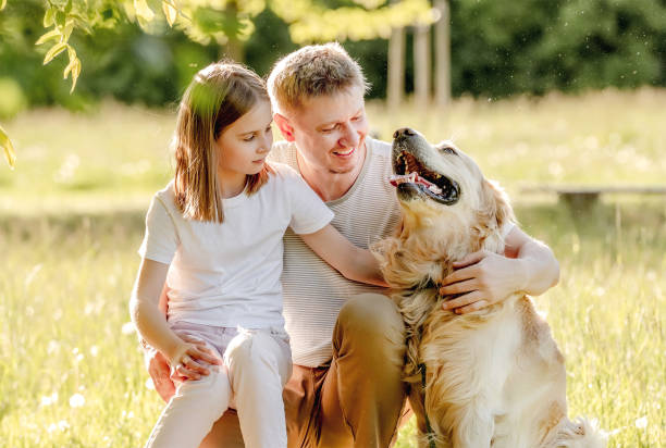 istock Dad and his daugter play with dog 1431989882