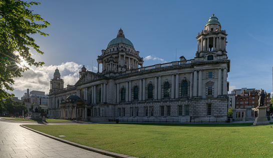 Belfast, United Kingdom - 21 August, 2022: view of the historic Belfast City Hall and Titanic Gardens in downtown