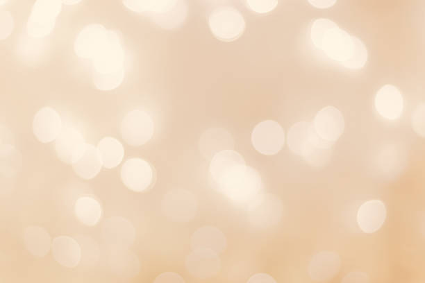 istock Defocused abstract bokeh background beige pastel colored, flare from lights, beige monochrome photo, blurred round bokeh as holiday fon, celebration wallpaper. Glittering aesthetic pattern 1431994131