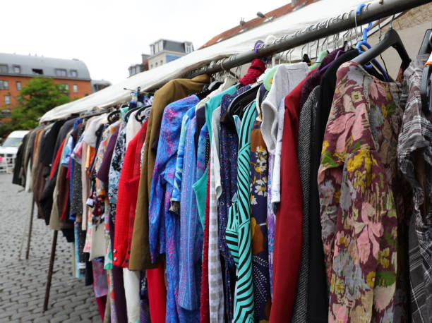 istock used clothes in the outdoor flea market stall 1431995201