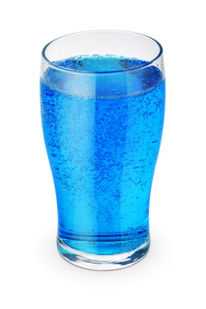 Glass of blue soda isolated on white background.