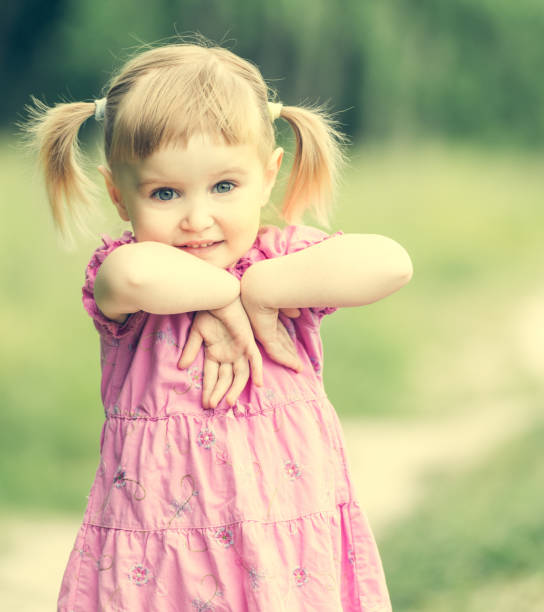 istock Cute little girl on the meadow 1432004478
