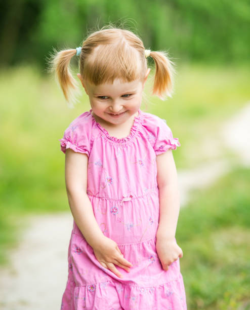 istock Cute little girl on the meadow 1432004488