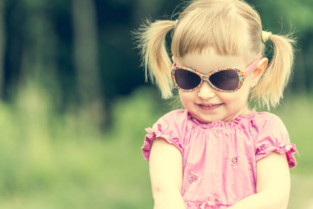 istock Cute little girl on the meadow 1432004495