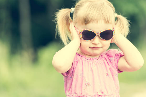 istock Cute little girl on the meadow 1432004514
