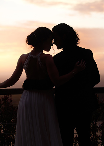 Wedding, couple and silhouette of a bride and groom outside after their marriage ceremony and romantic celebration. Love, romance and relationship with a man and woman together in matrimony outdoor