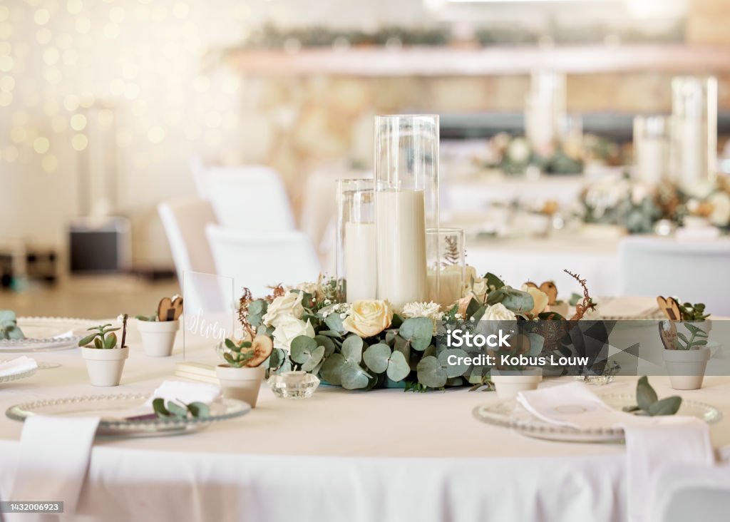 Wedding reception, table setting and celebration event with flower arrangement, decor and catering for a romantic setting. Party, luxury restaurant or fancy place with cutlery and tableware Wedding Stock Photo