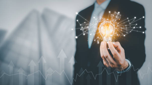 istock Businessman holding light bulbs, ideas of new ideas with innovative technology and creativity, concept creativity with bulbs that shine glitter, businessman holding illuminated light bulb, innovation 1432006942