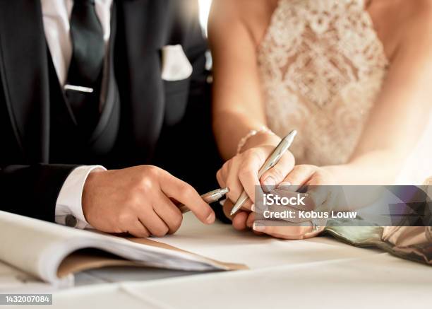 Couple Sign Wedding Certificate Marriage Registration And Document Paper For Legal Union Closeup Bride Groom And Hands Writing Contract For Celebration Of Love Commitment And Agreement Together Stock Photo - Download Image Now