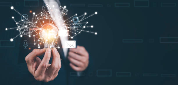 istock Businessman holding a bright light bulb, creativity with light bulbs and energy power, hand of a man with a light bulb and line light icon and using a notebook computer, technology innovation idea 1432008551