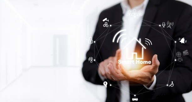 istock Businessman touch smart home automation assistant on a virtual screen and the user touches a button. technology interface on smartphone app screen with augmented reality (AR) Internet of Things view. 1432009070