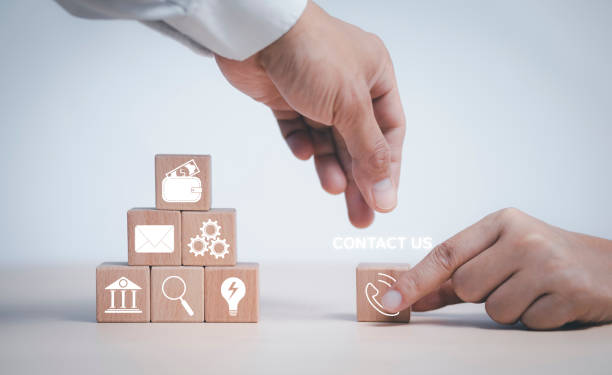 istock communication and technology and Cloud concept , Hand putting wooden block cube symbol telephone, email, address. Website page contact us or e-mail marketing, Contact us in customer support concept 1432009131