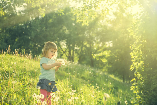 istock Happy little girl on the field 1432009925