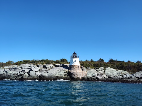 This short, cute lighthouse shines with a big light to direct ships to harbor.