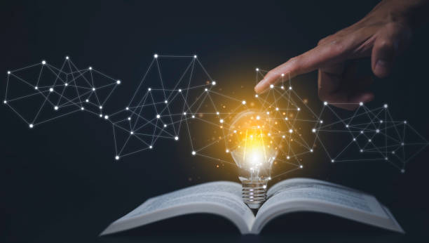 istock Thinking and creative concept, Light bulb on the Book and light bulb style bokeh vintage dark background,Concept The idea of reading books, knowledge, and searching for new ideas. 1432010428