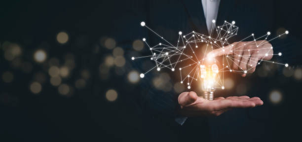 istock Businessman holding light bulbs, ideas of new ideas with innovative technology and creativity, concept creativity with bulbs that shine glitter, businessman holding illuminated light bulb, innovation 1432010865