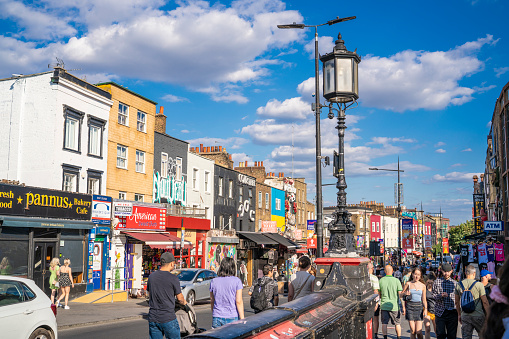 NW London Camden Town street in a summer sunny blue sky day. In 1791 was a residential district nowadays is a tourism and entertainment area wit music, street markets and an alternative culture, crossing the London Canal.
