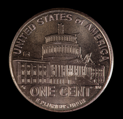 Reverse of 2009 US Lincoln penny commemorating the 200th anniversary of his birth. Ongoing 19th construction of the US Capitol dome