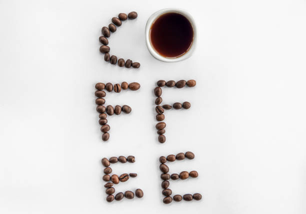 Close up of white coffee cup and coffee beans