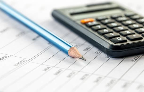 istock Calculator and pencil close-up on a blurred background. 1432018392
