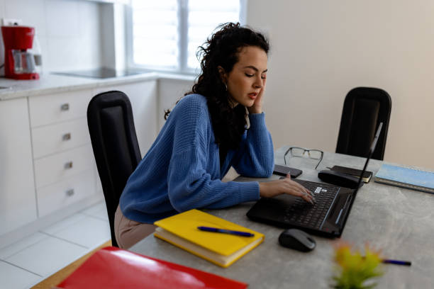 istock A young woman using laptop for work at home 1432019203