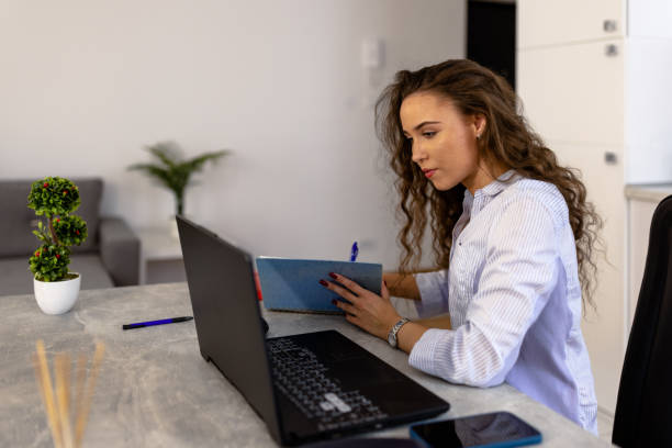 istock Beautiful young woman attending a class online 1432020206