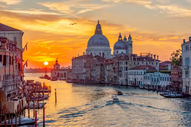 Photo of Venice Grand canal and Santa Maria della Salute church at sunrise, Italy