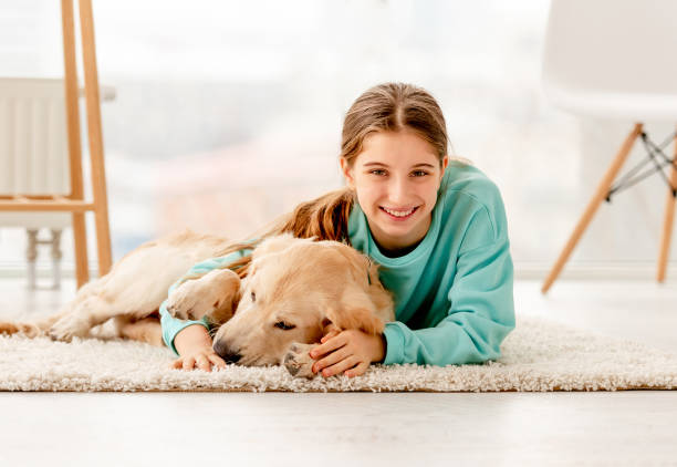 istock Girl lying next to dog 1432022783