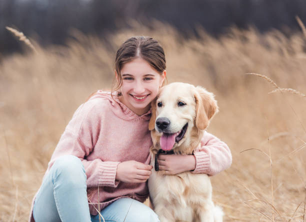 istock Beautiful girl with dog outside 1432022848