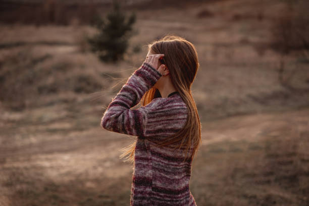 istock Nice girl standing sideways outdoors 1432023255
