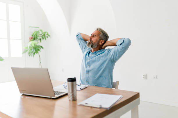 istock Concentrated senior businessman working at office 1432024093