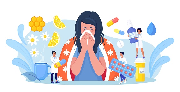 Young girl suffering from quinsy, or flu or any other virus cold. Woman sneezing and cough, using handkerchief or napkin. Ways to treatment illness with pills, medicines, hot tea with lemon, honey