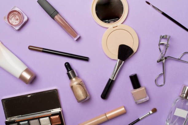 istock Different makeup products on color background, top view 1432026194