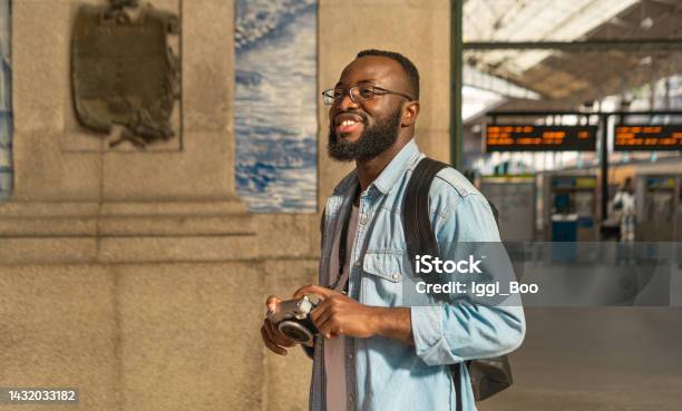Smiling Black Tourist Man At Portuguese Train Station Stock Photo - Download Image Now