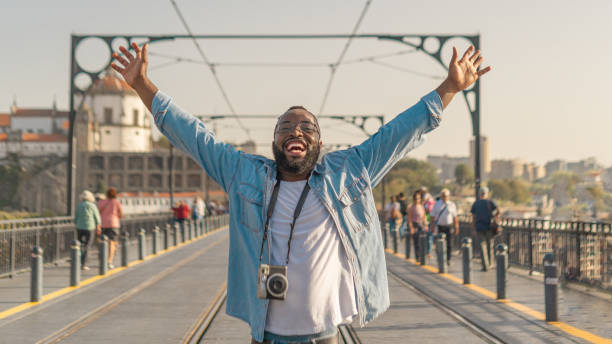 Happy Traveller man on the Oporto bridge stock photo