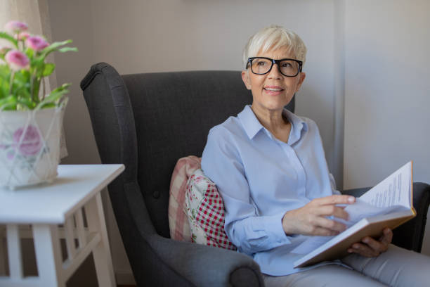 istock Woman relaxing and reading a book 1432034389