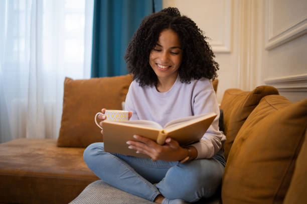 istock Woman relaxing and reading a book 1432034430