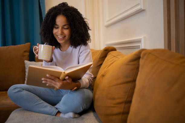 istock Woman relaxing and reading a book 1432034434
