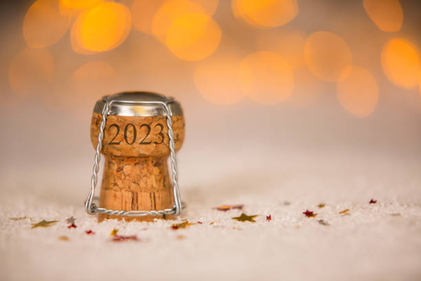 Happy New Year 2023 with Star Shape and Cork on the Snow stock photo