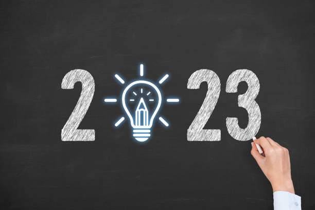 istock Human Hand Drawing New Year 2023 Creative Idea Concepts on Blackboard Background 1432035065