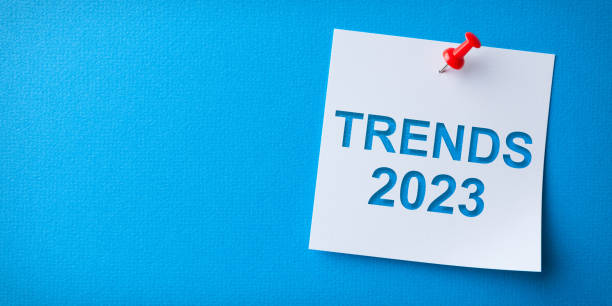 istock Trends 2023 Word in White Sticky Note on Blue Cardboard Background 1432035922