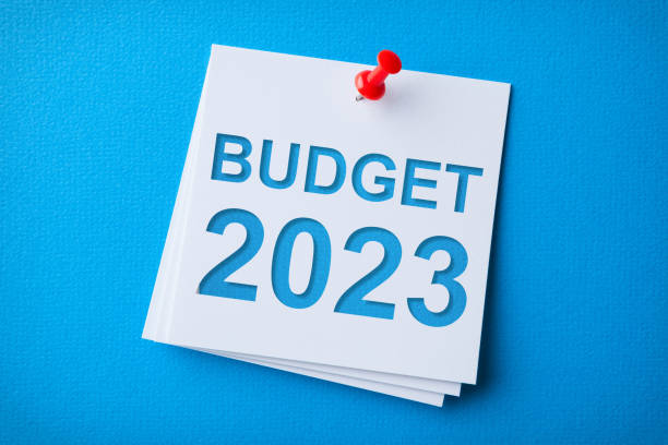 istock Budget 2023 Word in White Sticky Note on Blue Chardboard Background 1432035923