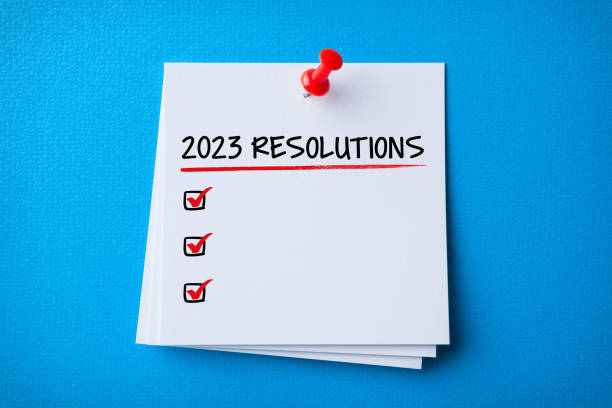 istock White Sticky Note With New Year 2023 Resolutions And Red Push Pin On Blue Cardboard Background 1432035926